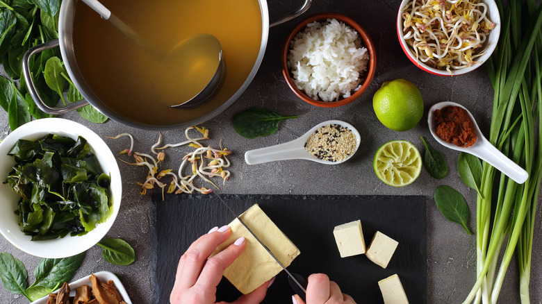 Person preparing miso soup