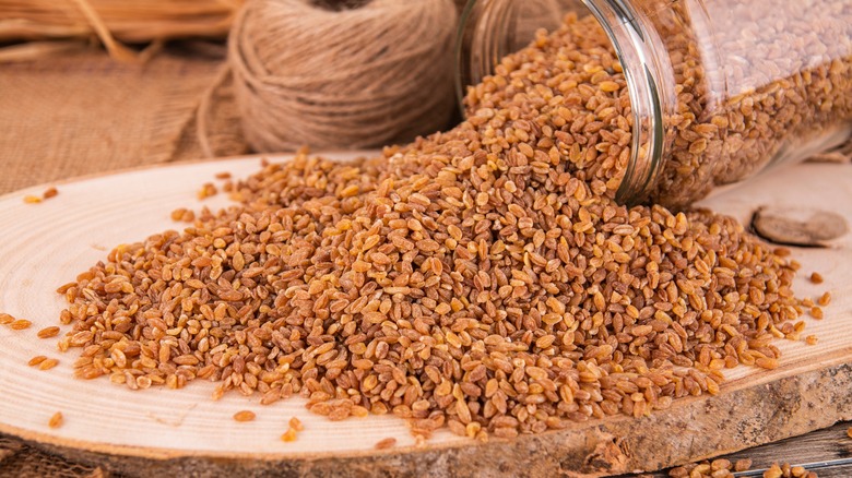 einkorn grains on wood