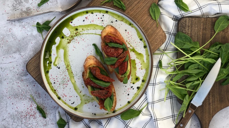 Sun dried tomato toast with green oil