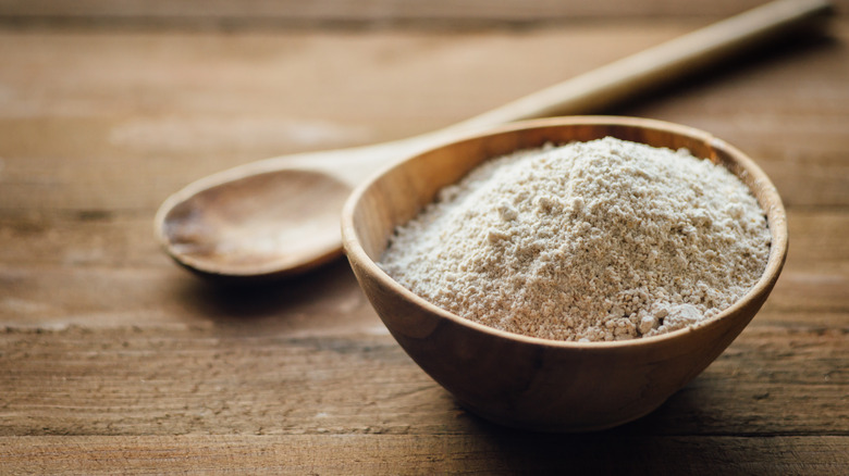 Flour in bowl on table