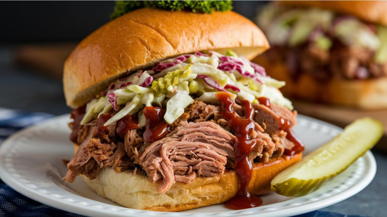 pulled pork sandwich with sauce and coleslsaw