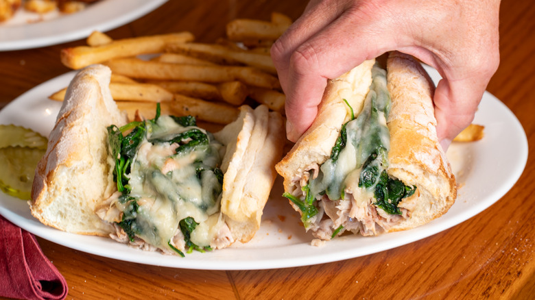 Italian roast pork sandwich with spinach and cheese