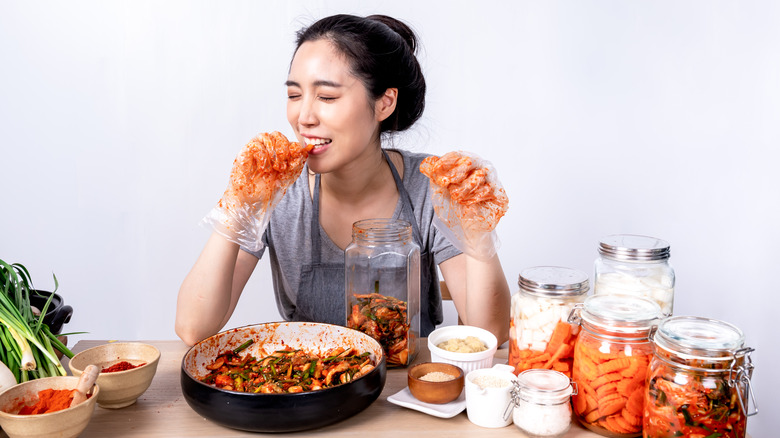 Woman eating kimchi