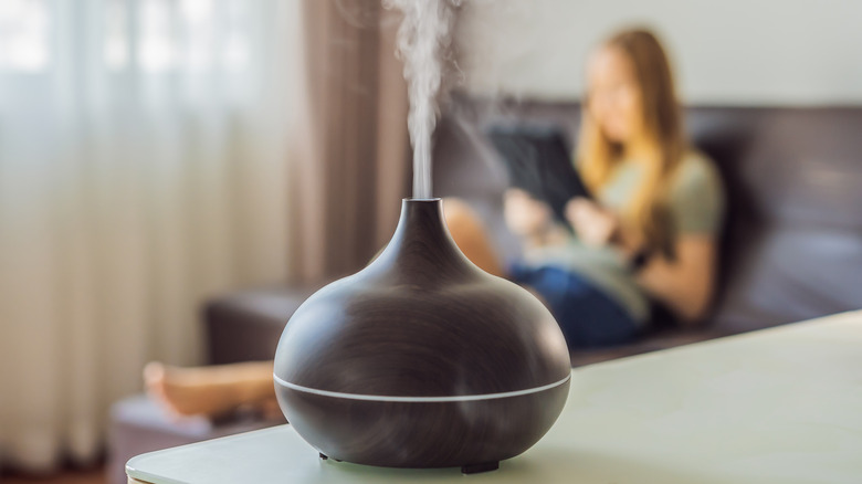 black diffuser for aromatherapy in foreground