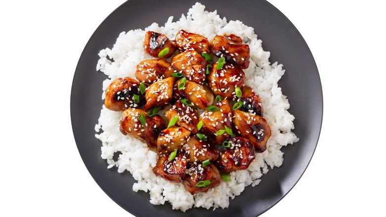 chicken teriyaki with rice topped with sesame seeds