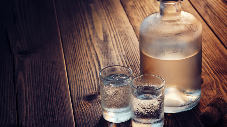 Moonshine bottle and shot glasses