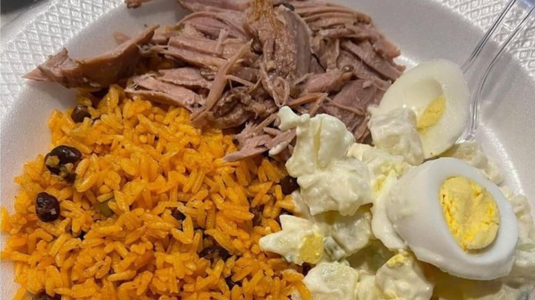 pernil with arroz con gandules and potato salad