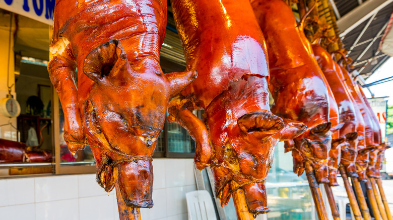 hanging lechon pigs