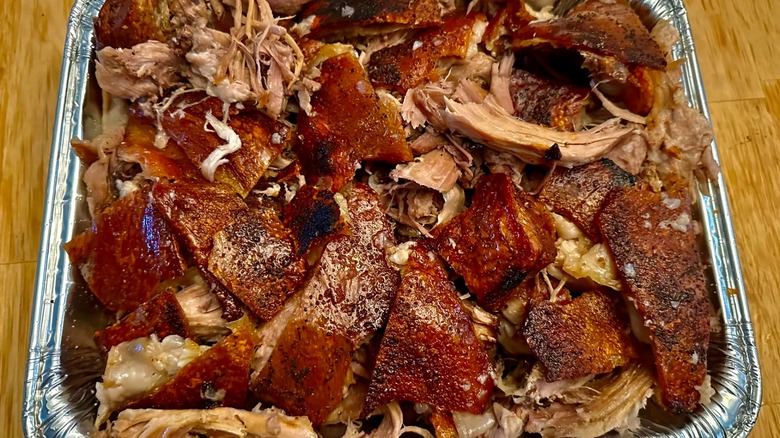 shredded pernil in a pan