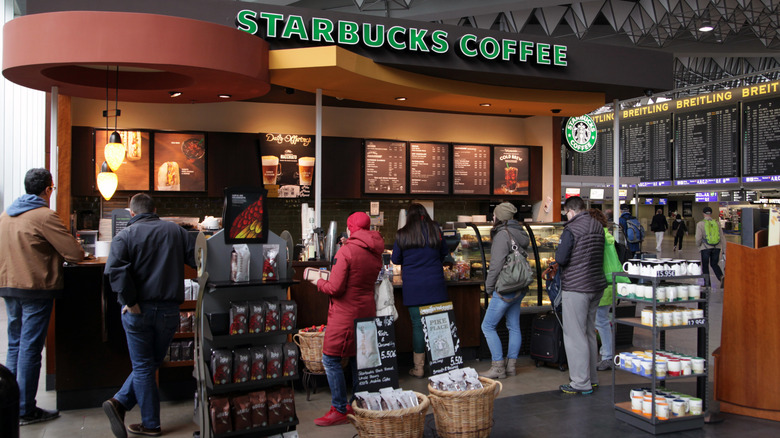 Customers in line at a Starbucks counter