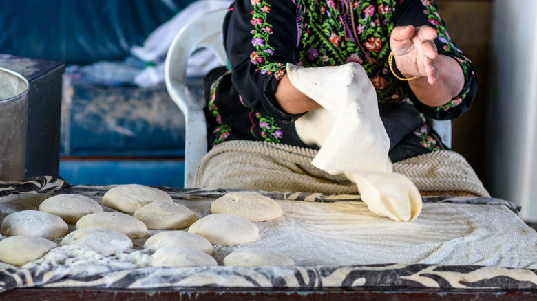 Woman making traditional taboon bread