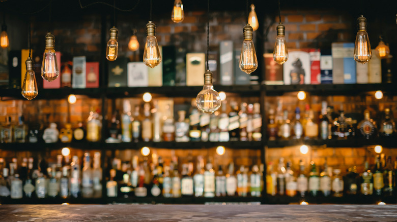 Blurred shelves of liquor