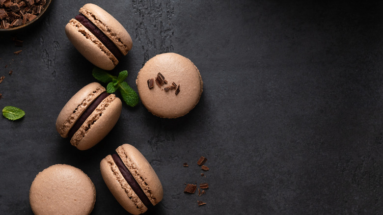 Chocolate macarons, fresh mint