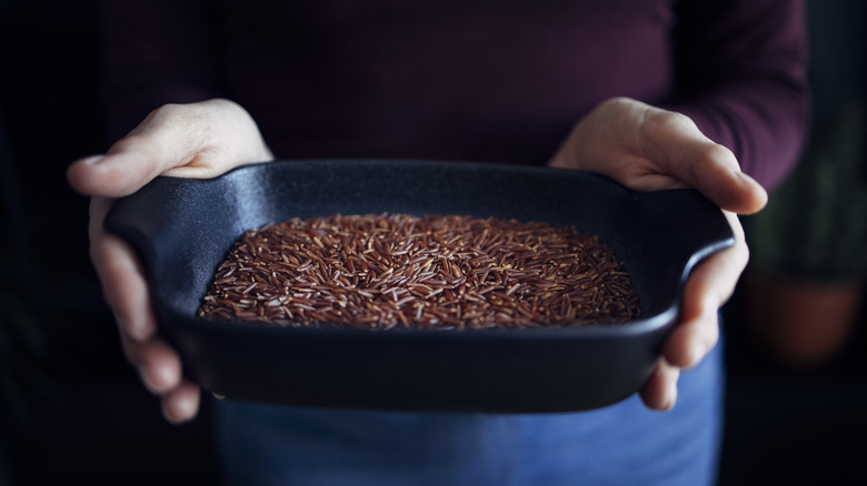 uncooked red rice in dish