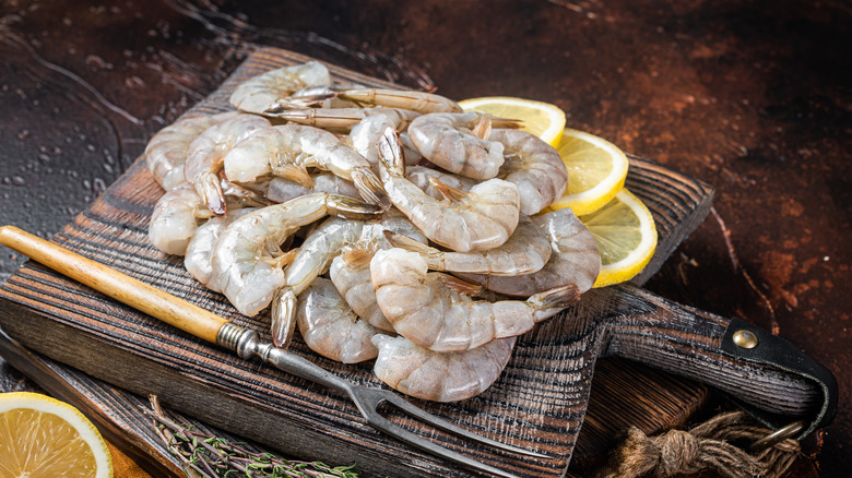 raw shrimp on cutting board