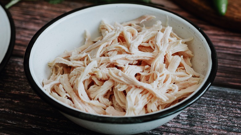 bowl of shredded chicken meat