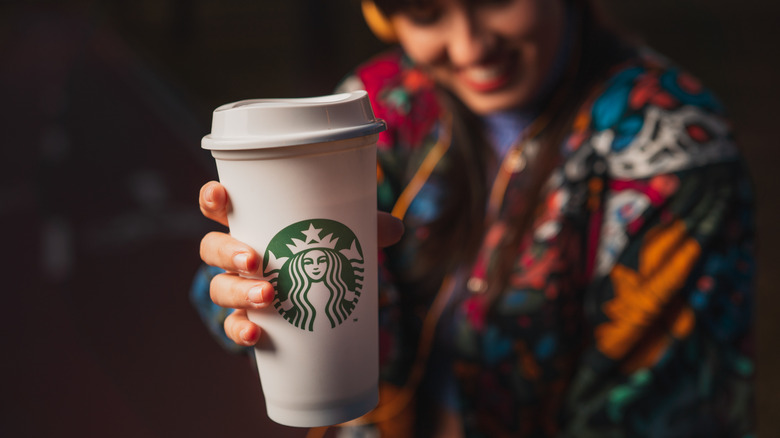 Woman with Starbucks coffee