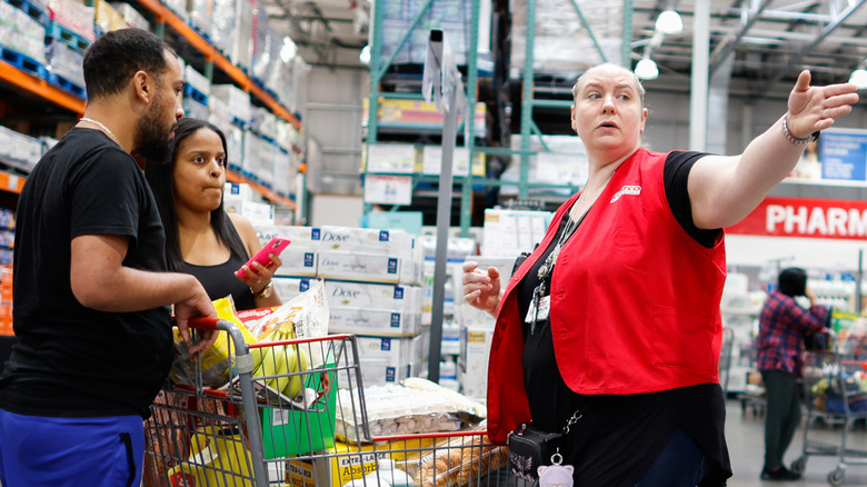 Costco employee in red vest