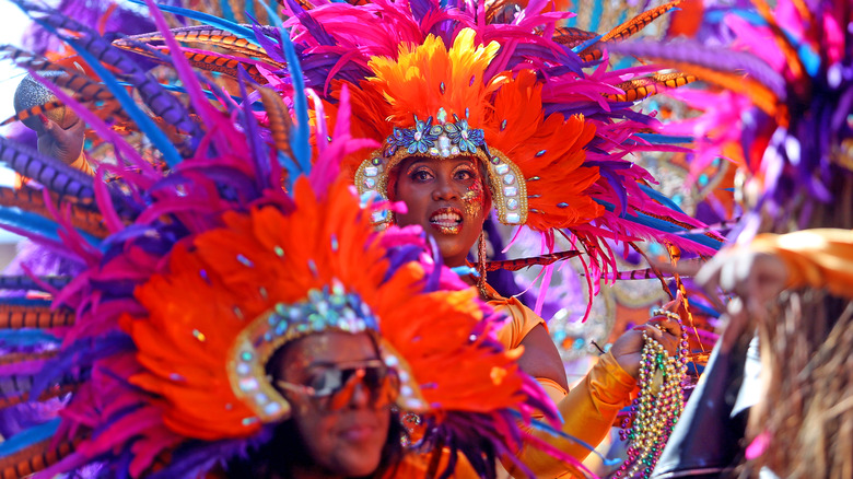 Women in Mardi Gras feather