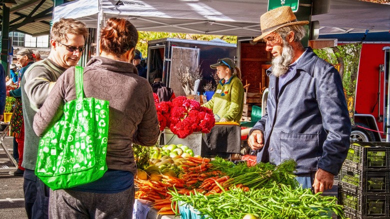 An Amish vendor selling vegetables