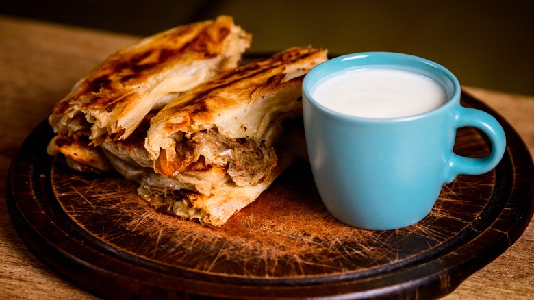 Sliced burek served with yogurt