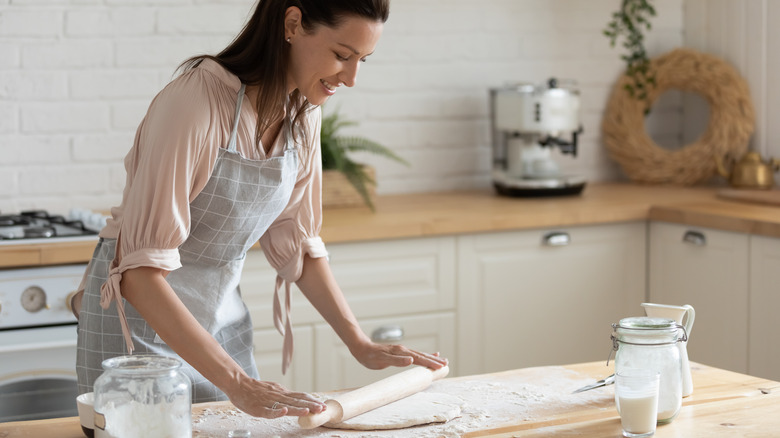 Woman rolling out dough