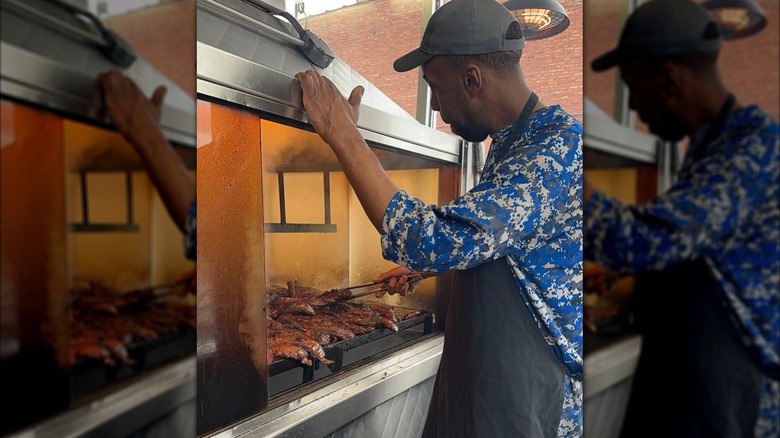 Chef at Lem's Bar-B-Q in Chicago cooks in an aquarium-style smoker