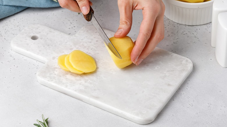 Slicing potatoes thin 