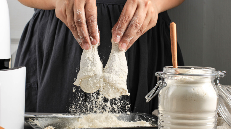 Woman breads chicken