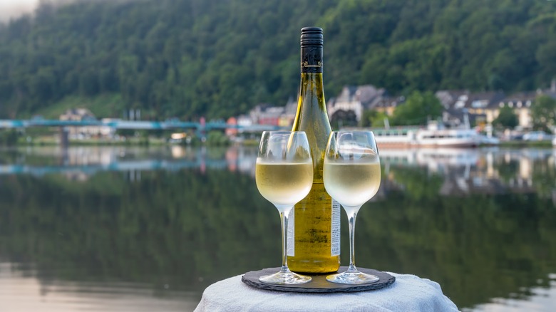 White wine glasses and bottle