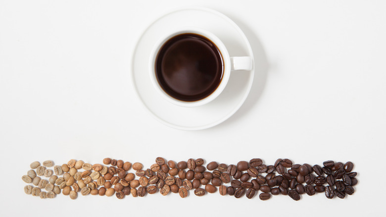 Roasted coffee beans and cup