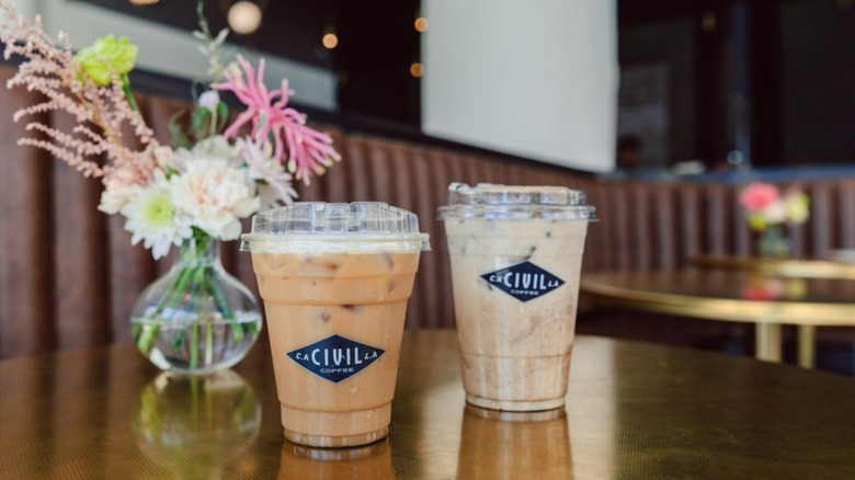 Civil Coffee drinks on table with flowers