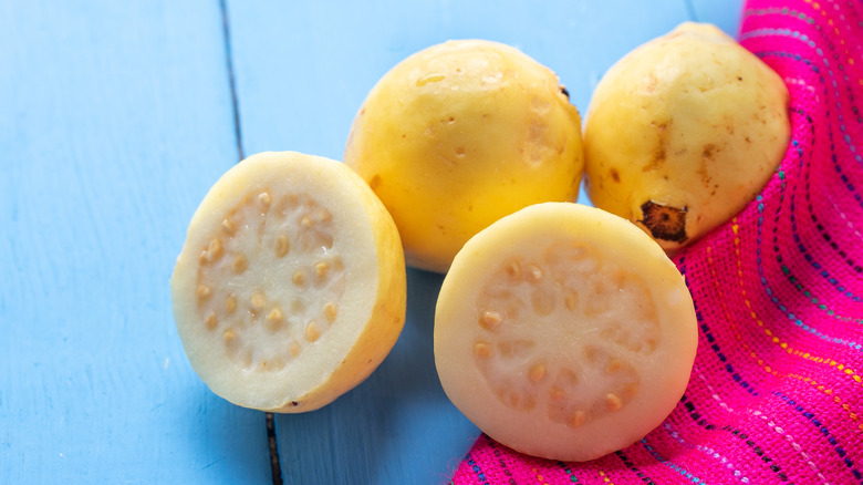 yellow guava on wood