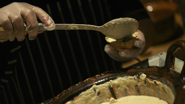 Mole blanco poured into bowl