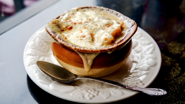 French onion soup in a crock on a plate