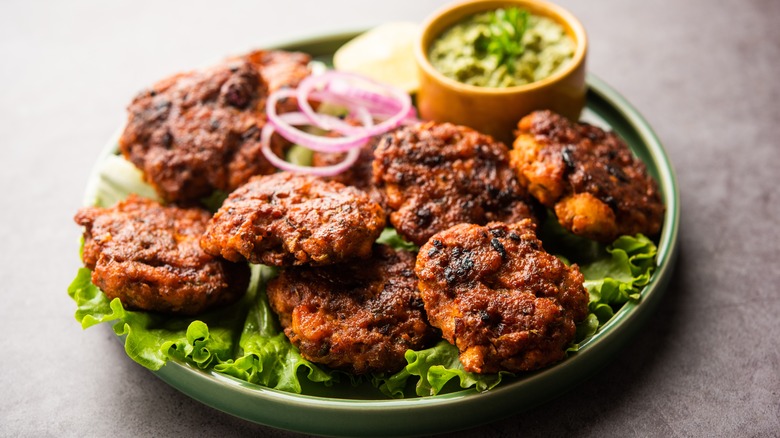 Chapli kababs on a salad