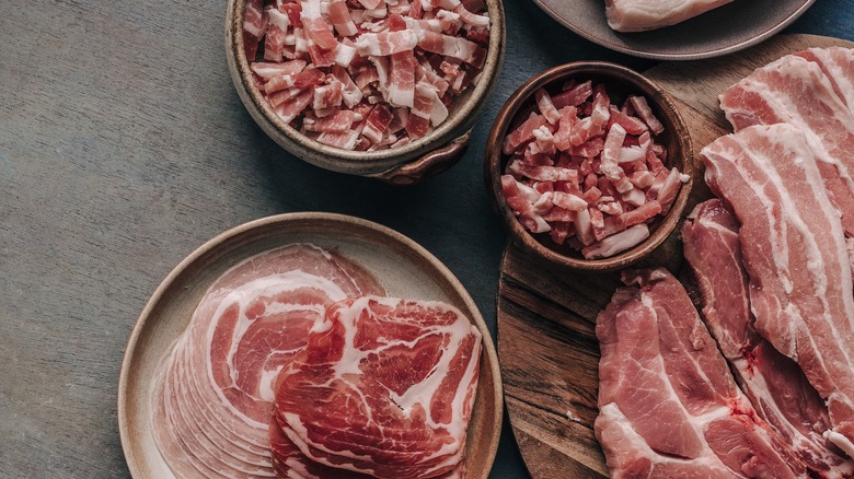 Bacon and pancetta on table 