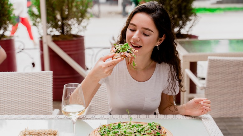 Girl eating pinsa