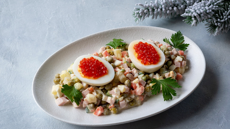 Russian potato salad with caviar 