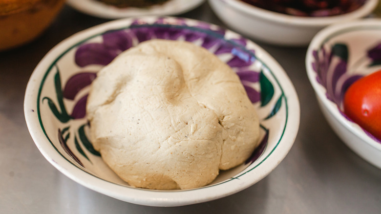 Uncooked masa dough in bowl