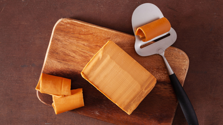 Scandinavian brown cheese cut on board