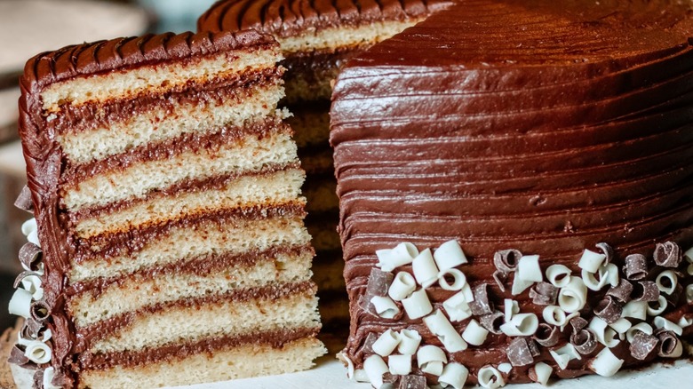 Slice being removed from a whole Smith Island cake