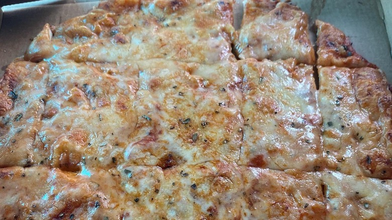 Provel cheese on St. Louis-style pizza