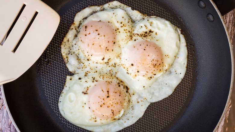 over-easy eggs in pan