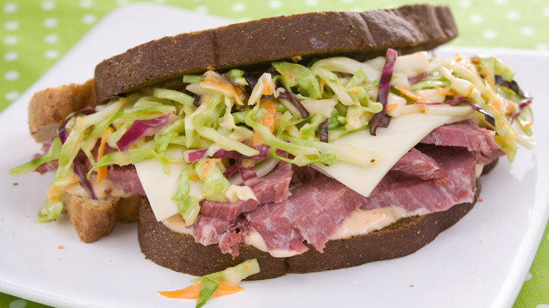 Sandwich with slaw, dressing, beef