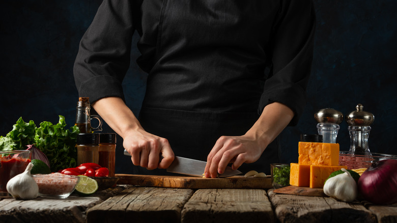 chef cutting garlic