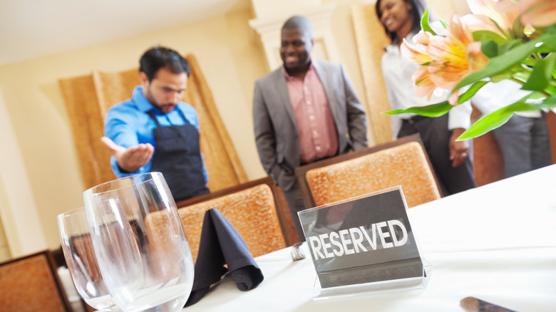 Couple being seated at a reserved table