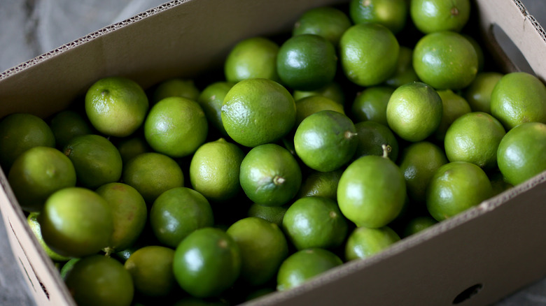 Limes in a cardboard box