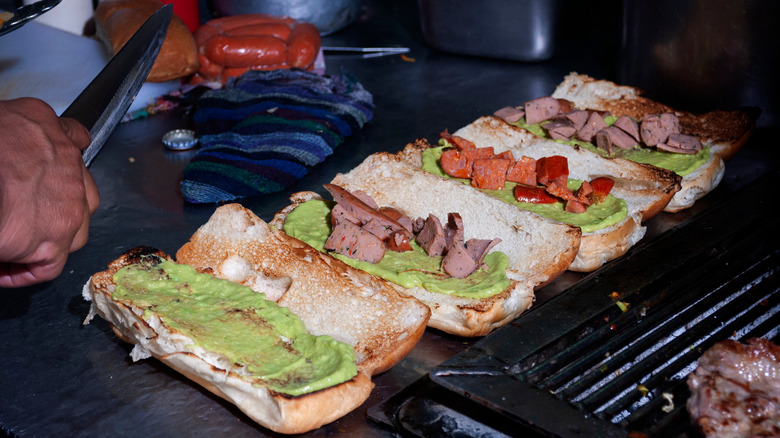 Guatemalan shucos being prepared