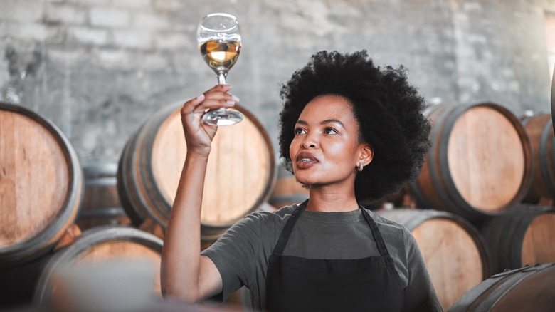 woman inspecting wine